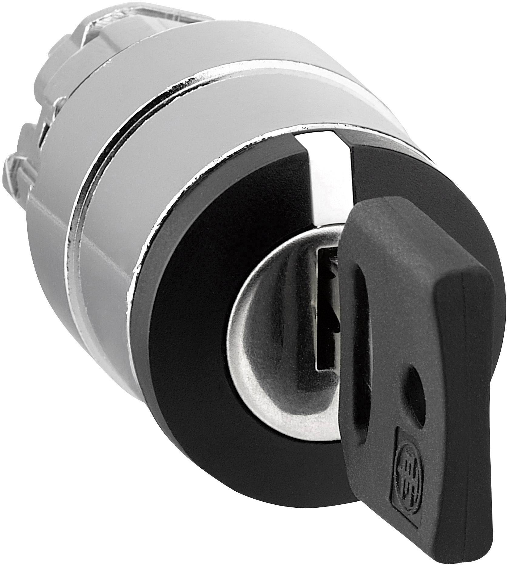 Silberfarbener Zündschalter mit schwarzem Schlüssel, der im Schloss steckt. Der Schalter ist rund und glatt.