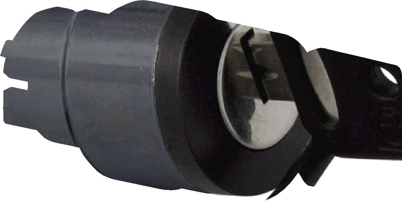 Ein schwarzes Zündschloss mit eingestecktem Schlüssel.