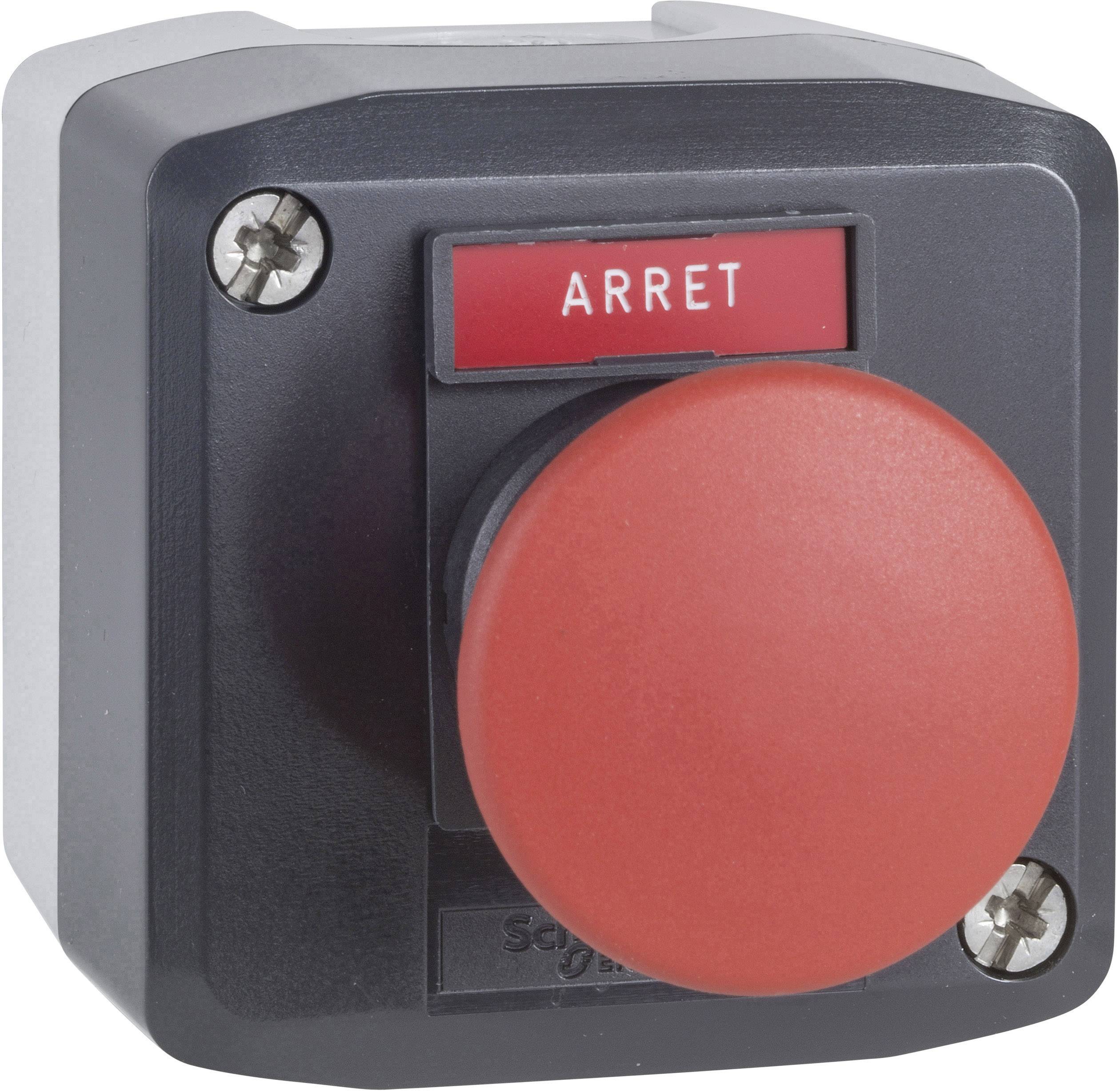 Roter Not-Aus-Schalter mit der Aufschrift 'ARRET', auf einer schwarzen quadratischen Basis befestigt, von Schrauben gesichert.