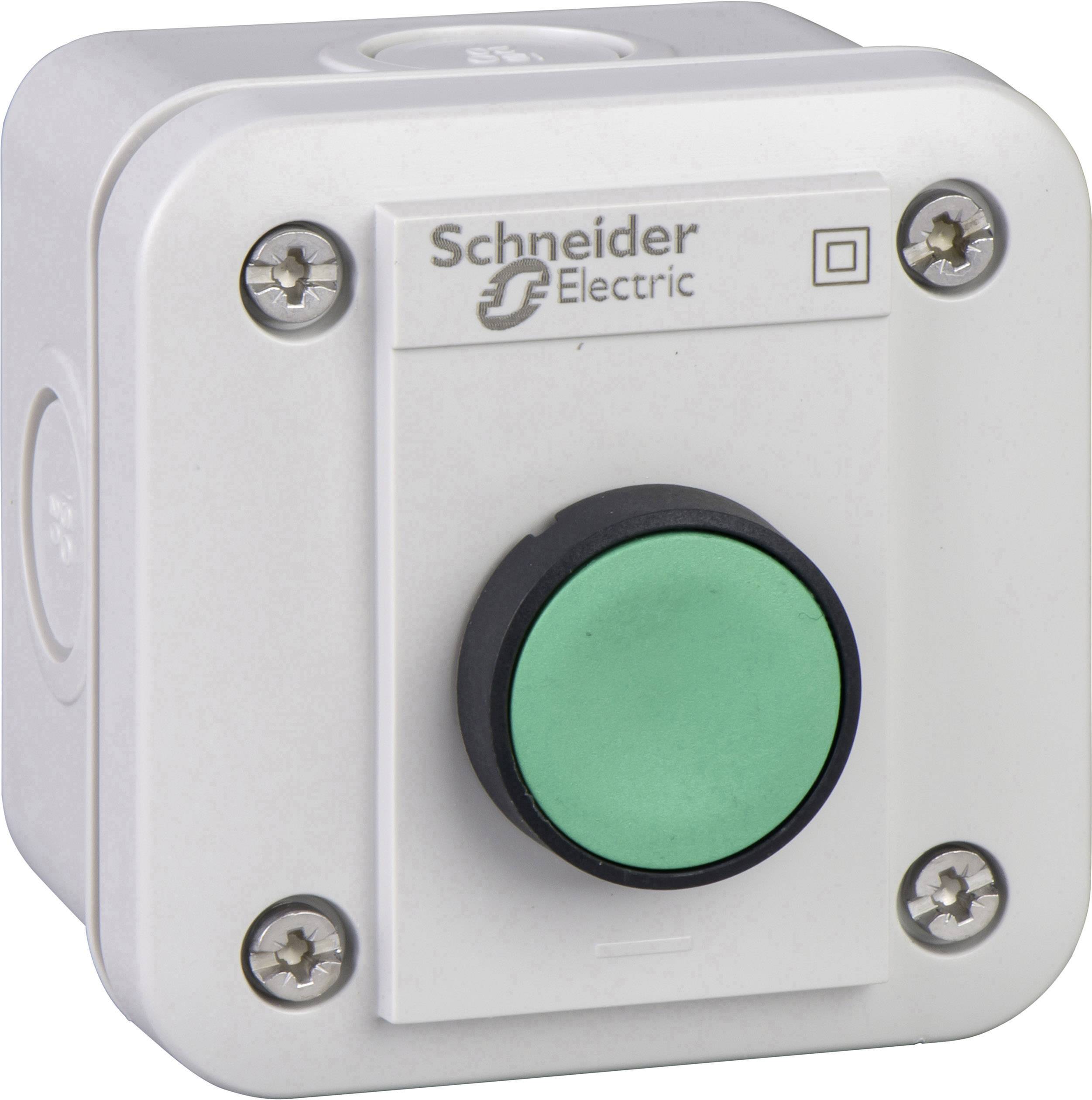 Ein quadratischer Druckschalter von Schneider Electric mit einem großen grünen Knopf, montiert auf einer weißen Plastikplatte.