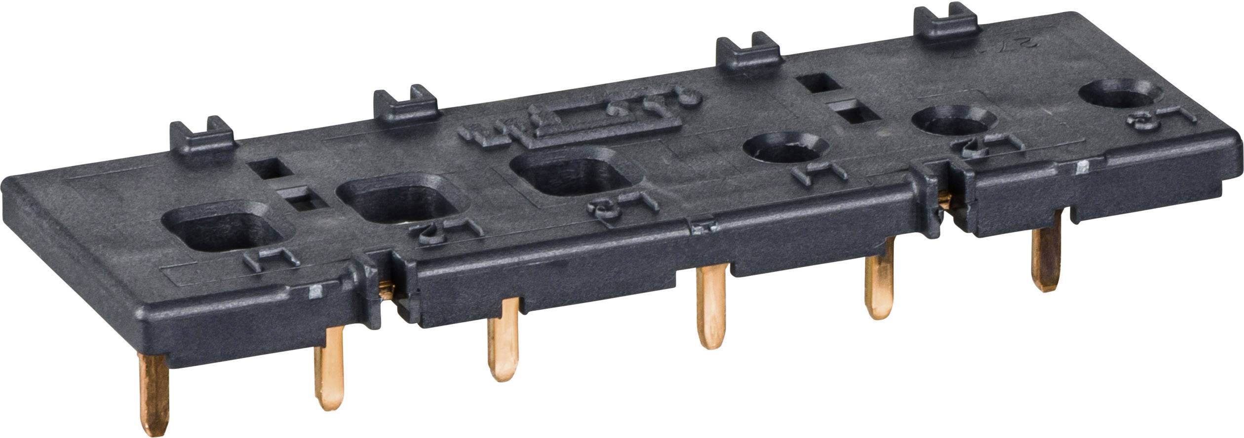 Schwarzes Kunststoffgehäuse mit mehreren Kupferstiften, wahrscheinlich ein elektronisches Bauteil oder ein Steckverbindungselement.
