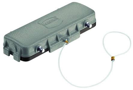 Grünes, rechteckiges Gerät mit zwei Anschlüssen an der Seite und einem angeschlossenen transparenten Schlauch.