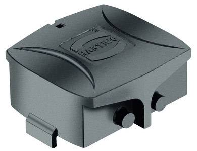 Schwarzes, rechteckiges Kunststoffgehäuse mit runden Ecken und zwei kleinen runden Hebeln an der unteren Kante. Geprägtes Logo.