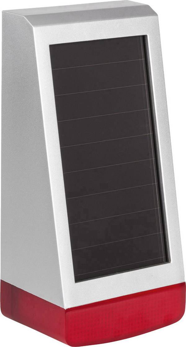 Silbernes, solarbetriebenes Gerät mit schwarzem Solarpanel und rotem Sockel, möglicherweise eine Leuchte oder ein Alarmgerät.