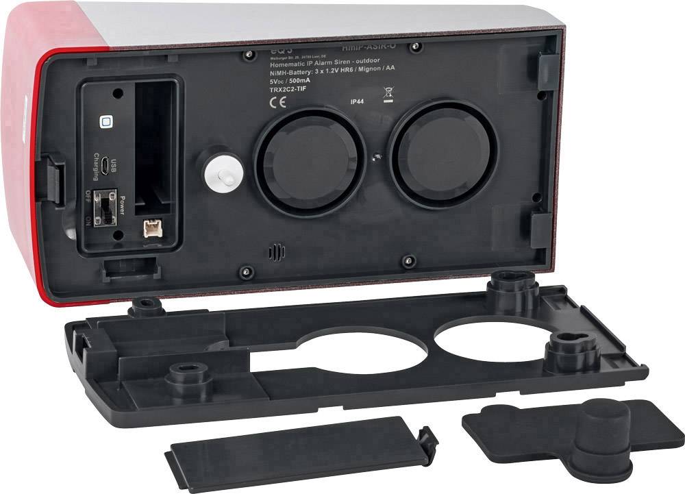 Ein rotes elektronisches Gerät mit abgenommener Abdeckung zeigt zwei runde Lautsprecher, einen USB-Anschluss und einen Netzwerkanschluss.