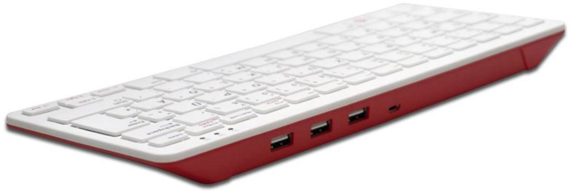 Weiße Tastatur mit roten Akzenten, seitlich geneigt, zeigt drei USB-Anschlüsse auf der rechten Seite.