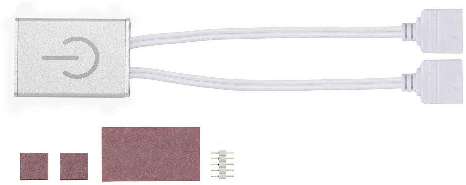 Ein elektrisches Zubehör mit zwei Kabeln. Daneben liegen drei rote Pads und ein kleines Steckerelement.