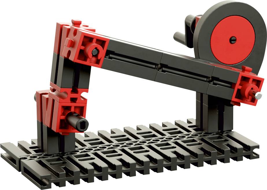 Ein mechanisches Modell aus roten und schwarzen Bausteinen zeigt einen einfachen Hebelmechanismus.