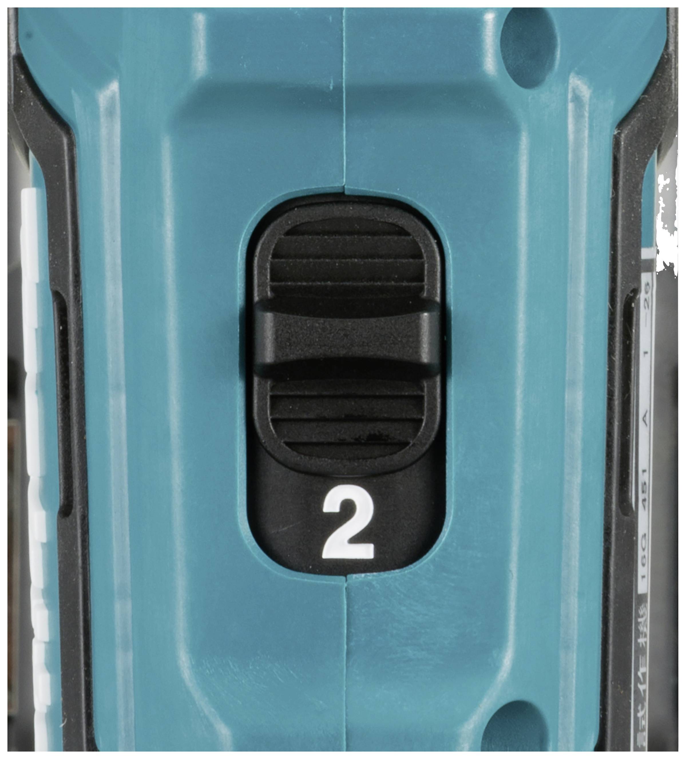 Ein Schalter mit zwei Einstellungen auf einem blauen Gerät. Die Einstellung '2' ist ausgewählt.