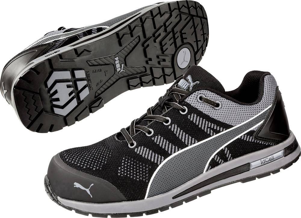 Zwei schwarze Sportschuhe mit grauem Muster und markantem Profil. Die Schuhe zeigen das Puma-Logo auf der Seite und Sohle.