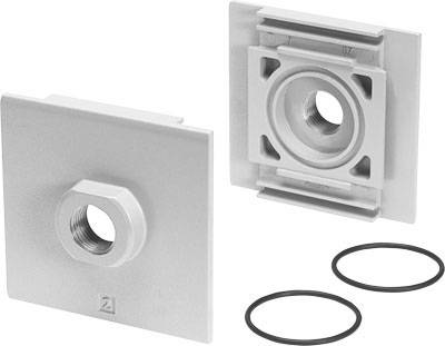 Zwei graue quadratische Befestigungsplatten mit zentraler Öffnung und zwei schwarzen Dichtungsringen. Hauptsächlich für Montagezwecke.