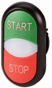 Ein ovaler Taster mit zwei Bereichen: grün oben mit 'START', rot unten mit 'STOP'. An einem elektrischen Gerät angebracht.
