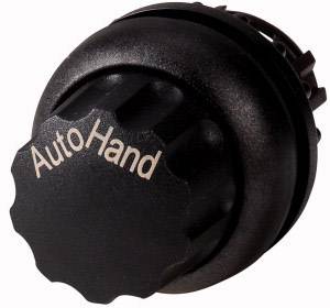 Ein schwarzer Drehknopf mit der Aufschrift 'Auto Hand', vermutlich zur Einstellung zwischen automatischem und manuellem Modus.