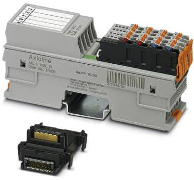 Graues elektronisches Gerät mit Anschlussklemmen und Beschriftungsfeld, daneben ein separates schwarz-goldenes Anschlussmodul.