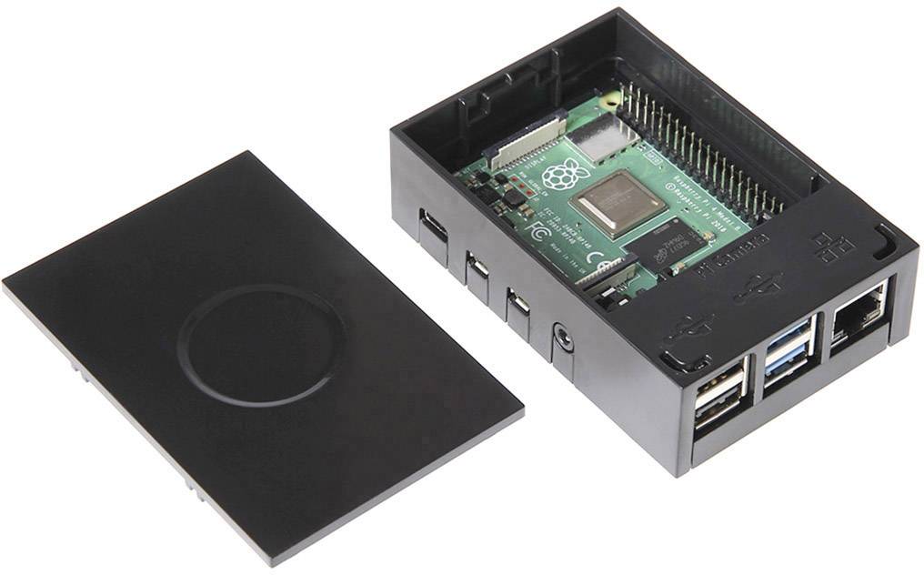 Ein offenes schwarzes Gehäuse mit einem Raspberry Pi-Board, das mehrere USB-Anschlüsse und Ethernet-Anschlüsse zeigt.