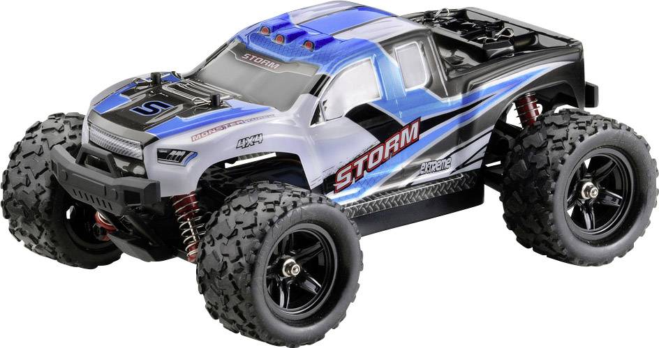 Ein blau-weißer ferngesteuerter Monstertruck mit großen Reifen und der Aufschrift 'STORM' auf der Seite.