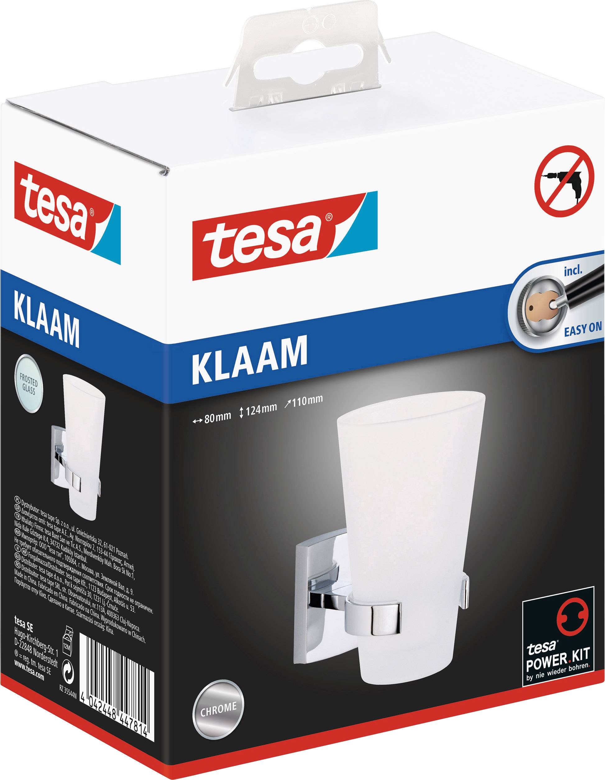 Verpackung der Tesa KLAAM Wandhalterung mit Becher. Zeigt ein elegantes, modernes Design in Chrom. 'Inkl. Power.Kit' und 'Easy On'.