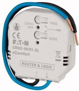 Ein weißer Schaltaktor mit blauen und schwarzen Drähten. Aufschrift: 'EATON CROU-00/01-SL xComfort'. Etiketten: '230VAC', '50Hz', 'PROG', 'MODE'.