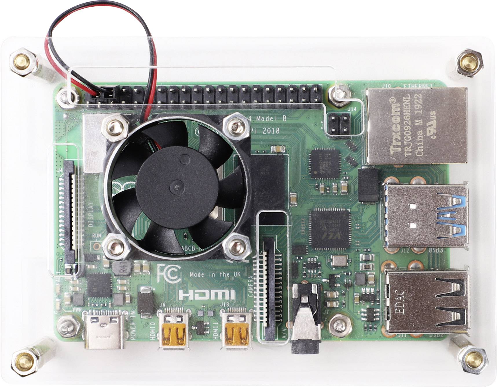 Eine kleine grüne Platine mit Lüfter und verschiedenen Anschlüssen, darunter HDMI und USB. Text darauf: 'HDMI' und 'Made in UK'.