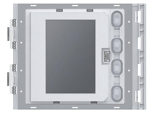 Grauer elektrischer Verteilerkasten an einer Wand, mit mehreren runden Kabelanschlüssen auf der rechten Seite.