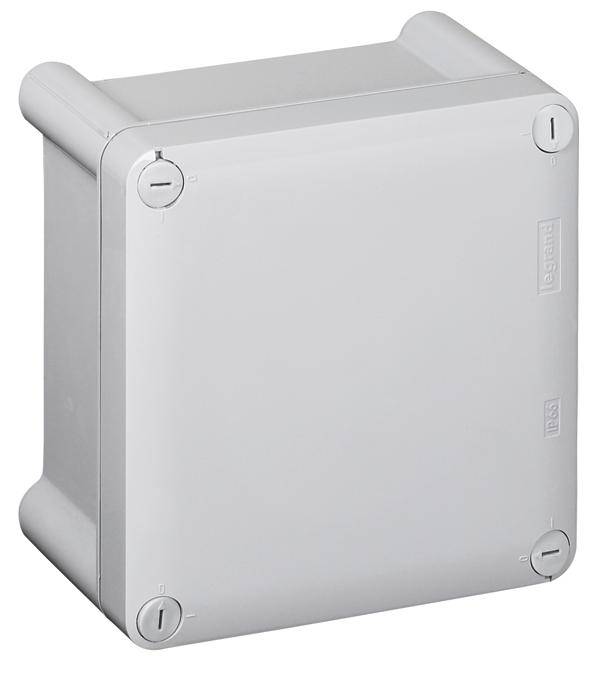 Eine graue elektrische Anschlussdose mit runden Kanten und Schraubbefestigungen an allen vier Ecken.