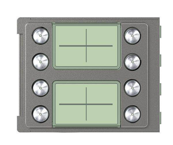 Eine rechteckige, graue Metallplatte mit zwei großen grünen Bereichen und vier runden metallischen Knöpfen an jeder Seite der grünen Bereiche.