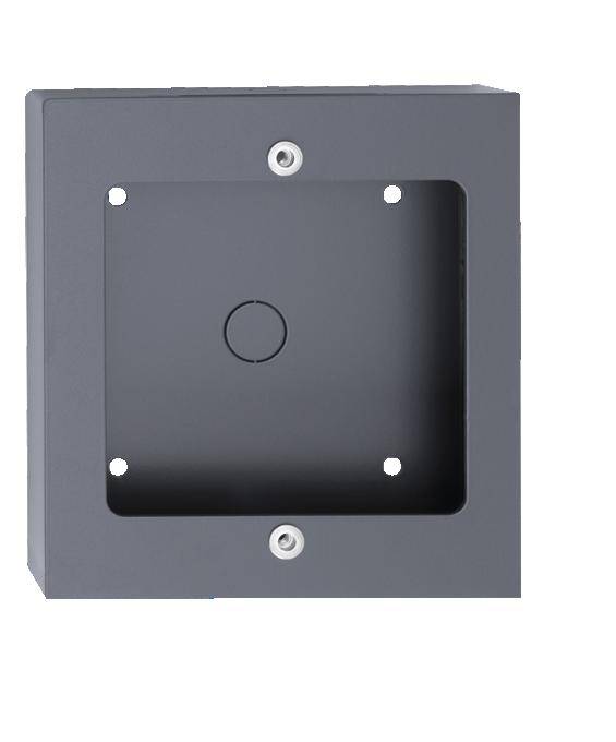 Ein leeres, quadratisches, dunkelgraues Gehäuse mit vier Bohrlöchern an den Ecken und zwei zentralen Öffnungen an Ober- und Unterseite.