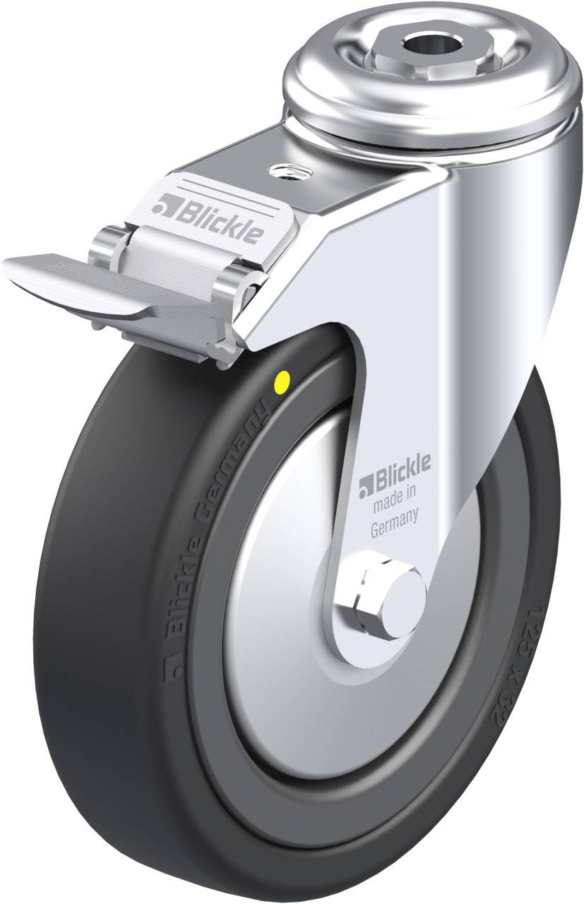 Schwenkrolle aus Metall mit grauer Gummireifen, Bremshebel oben. Aufschrift 'Blickle, made in Germany' sichtbar.