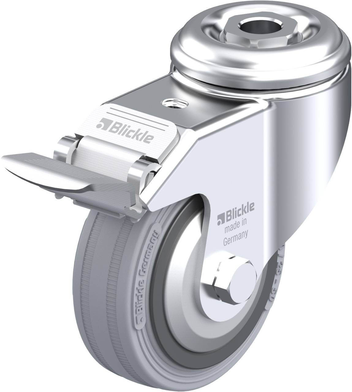 Rollenrad aus Metall mit Bremse, mehrsprachige Produktaufschrift 'Blickle made in Germany', glänzende Oberfläche.