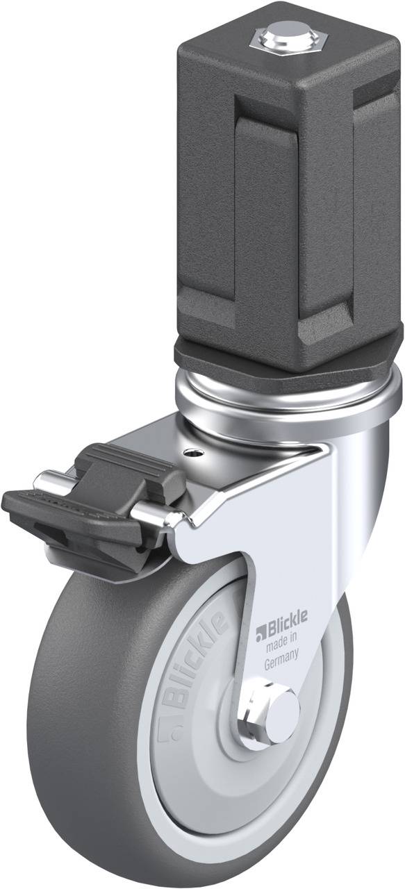 Industrie-Rolle mit grauem Gummi-Rad und schwarzer Bremse, montiert auf einem rechteckigen Stahlgehäuse mit Befestigungslot.