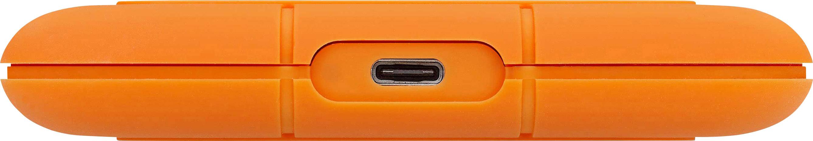 Orange, tragbare Festplatte mit einem mittig platzierten USB-C-Anschluss. Robust und stoßfestes Design für den Außeneinsatz.