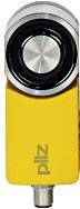 Gelbes Sicherheitsmodul mit silbernem Rundknopf; Marke 'Pilz'. Wird in Industrieanlagen zur Sicherheitsüberwachung eingesetzt.