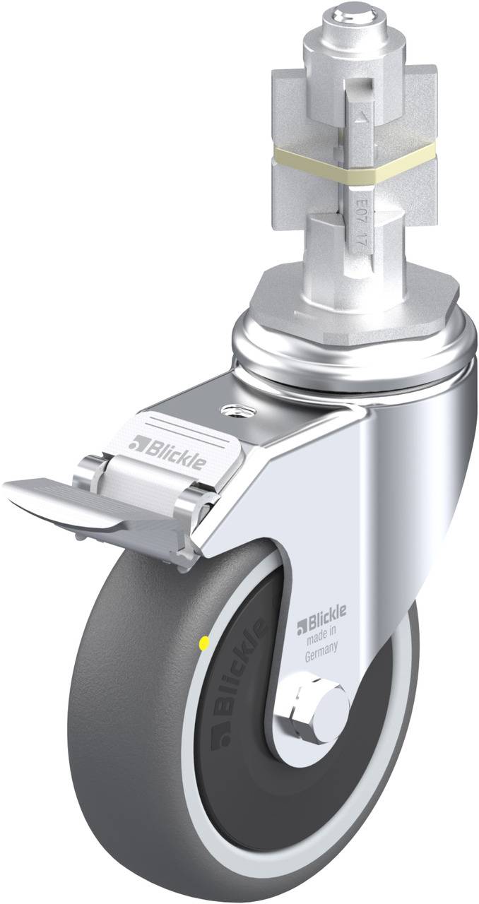 Eine weiße, moderne Saftpresse mit einem Hebel und einem kegelförmigen Presskopf, die auf einer weißen Oberfläche steht.