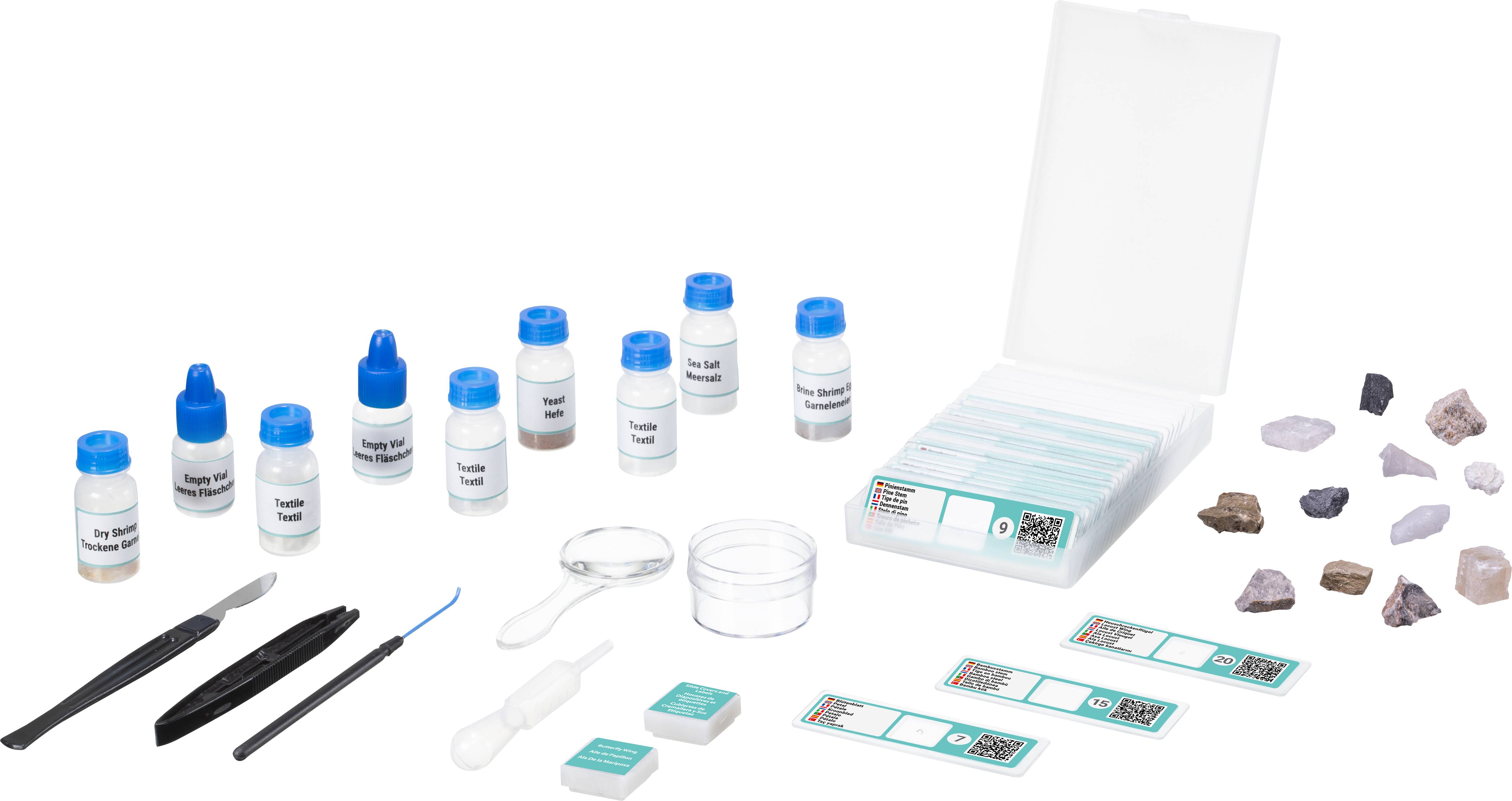 Eine Mineralien-Bestimmungskit mit Reagenzflaschen, Lupen, Werkzeuge und verschiedenen Steinen, optimal zur Analyse und Untersuchung von Mineralien.