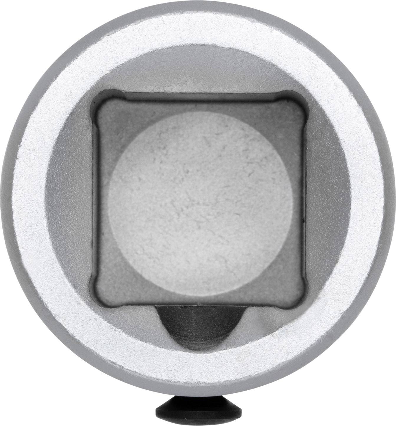 Blick von oben auf ein mechanisches oder technisches Teil mit einer kreisförmigen Öffnung und einem quadratischen Innenbereich.