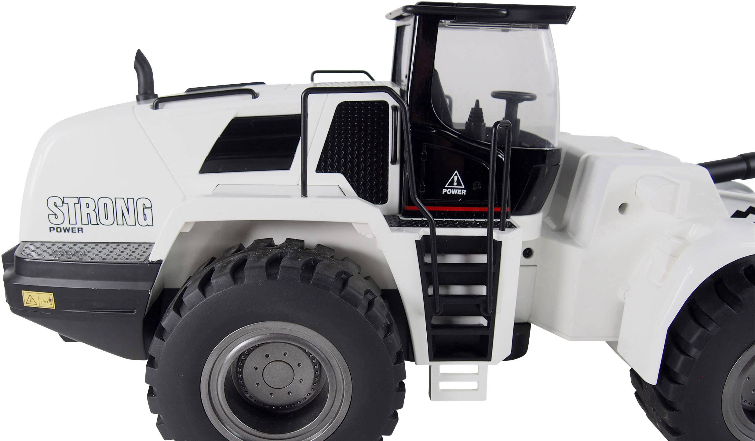Ein weißer Spielzeug-Lader mit großen schwarzen Reifen und schwarzer Fahrerkabine, markiert mit 'STRONG POWER' an der Seite.