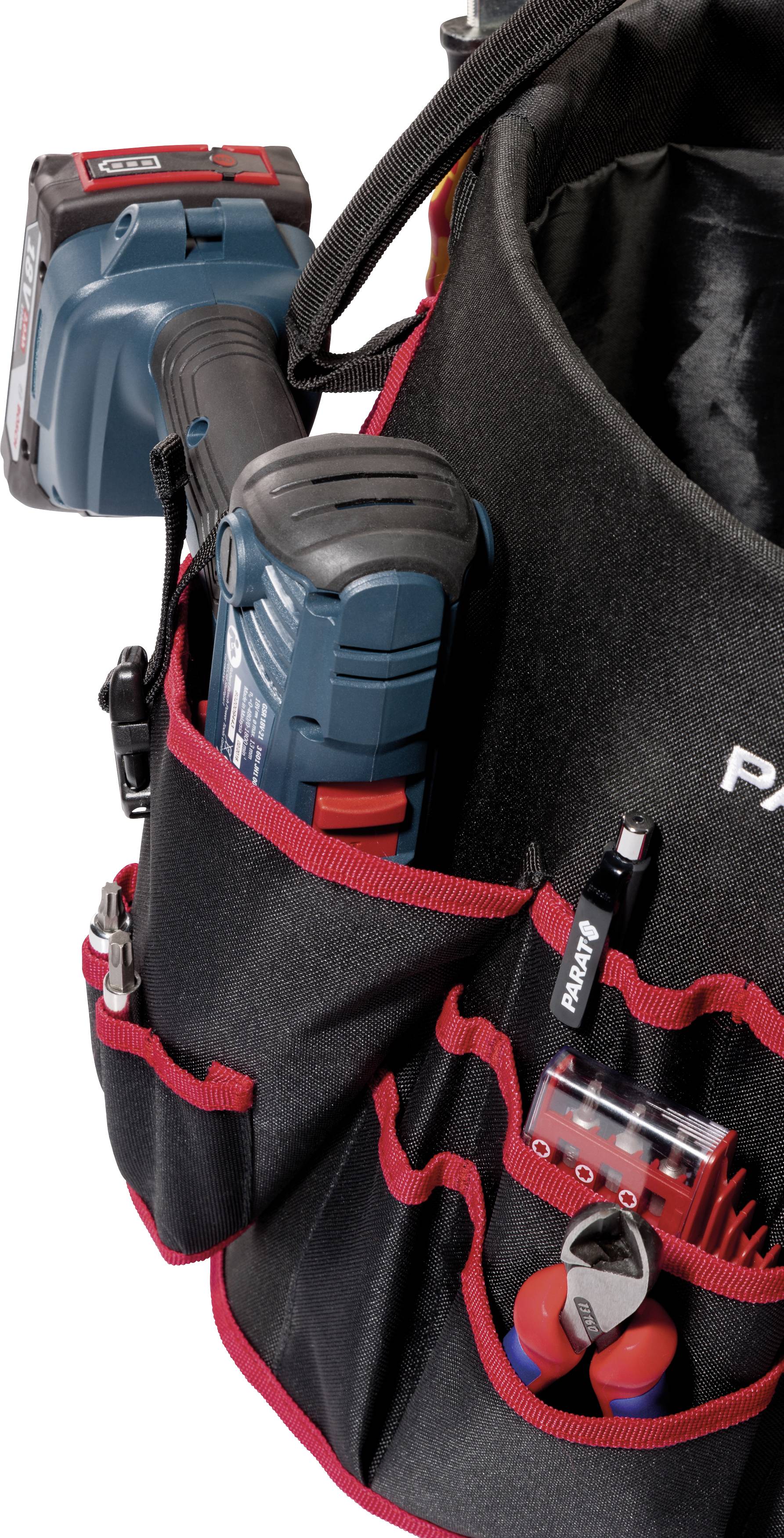 Eine Werkzeugtasche mit mehreren Fächern, die diverse Werkzeuge und eine Akku-Bohrmaschine enthält.