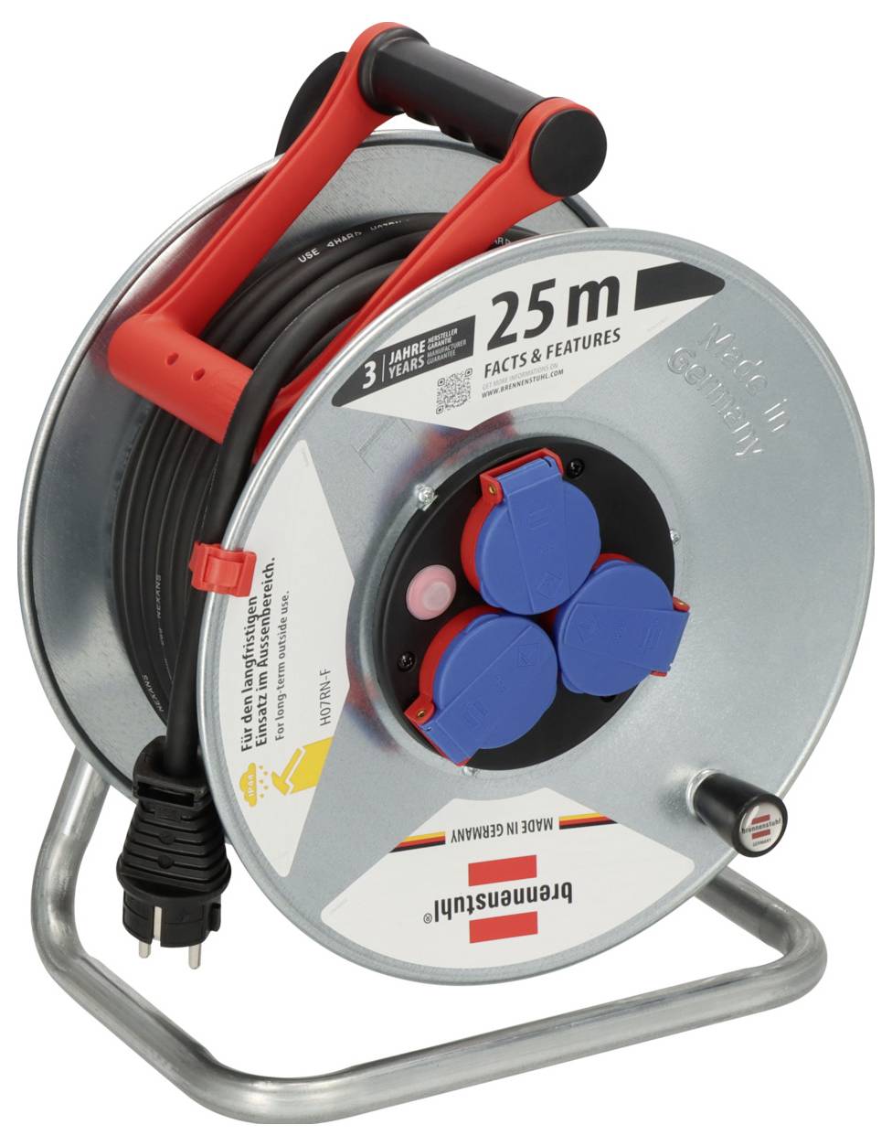 Kompakte Metallkabelrolle mit rotem Griff, schwarzem Kabel und drei blauen Steckdosenabdeckungen; mit Bezeichnung 25 m und 3 Jahre Garantie.