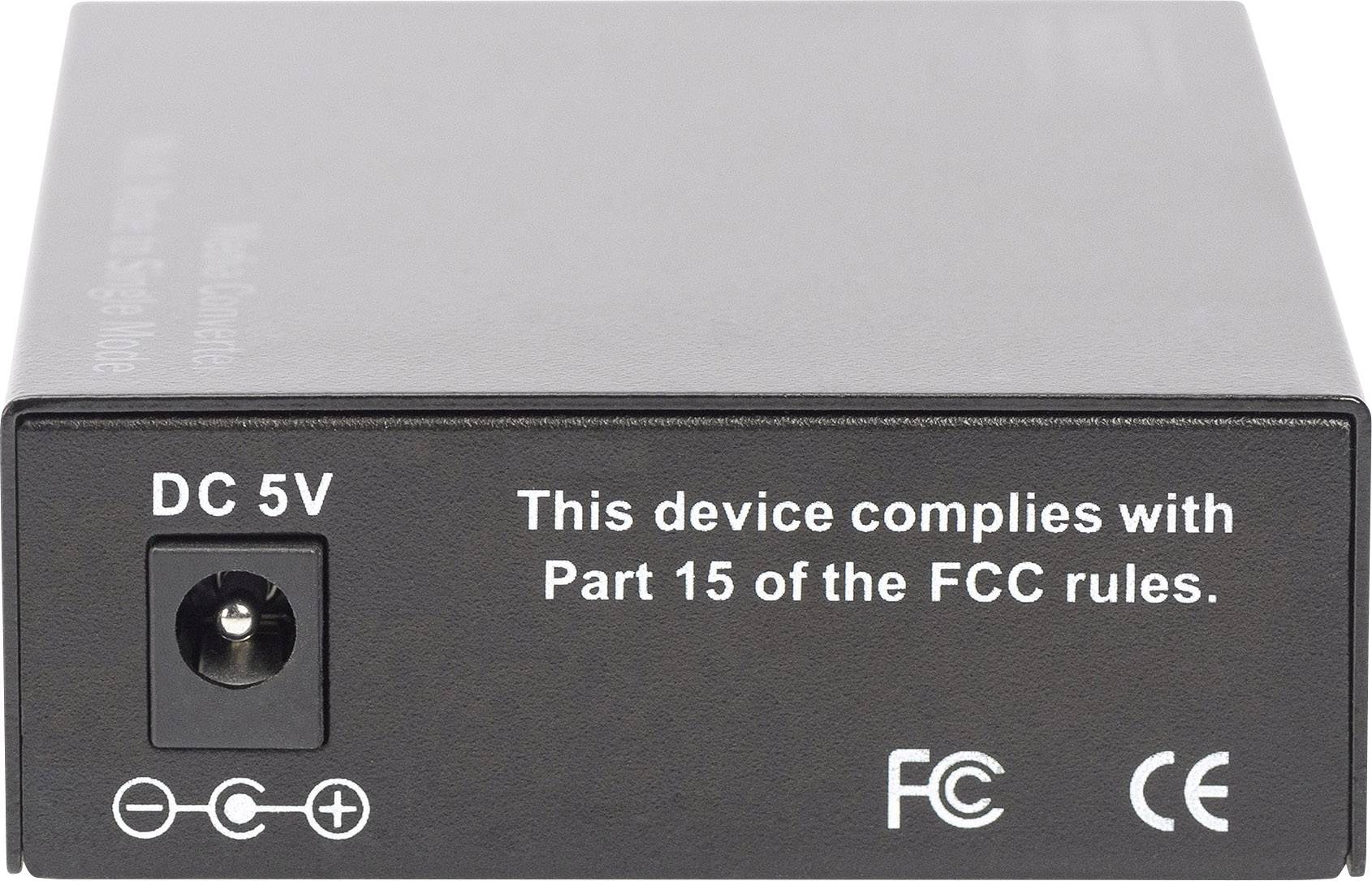 Schwarzes Gerät mit einstellbarer DC 5V-Strombuchse. Aufschrift: 'This device complies with Part 15 of the FCC rules.' FCC- und CE-Symbole.