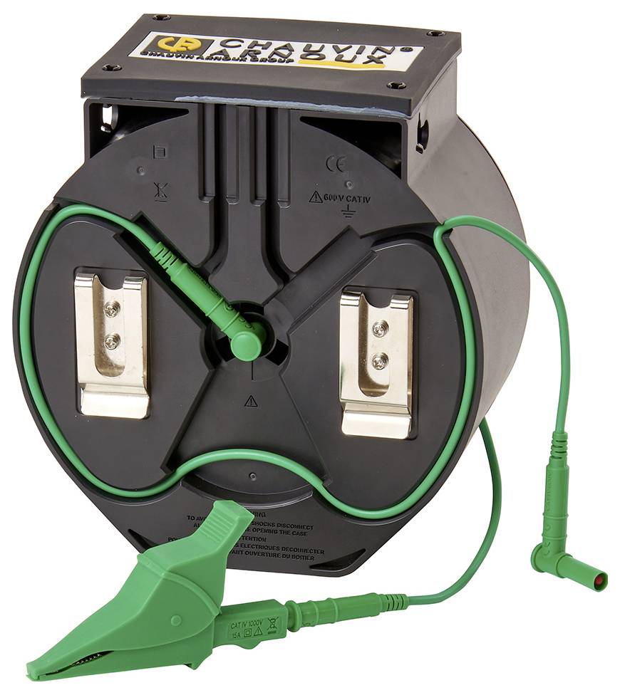 Ein rundes schwarzes Gerät mit zwei Metallklammern und grünen Kabeln. Es ist vermutlich ein elektrisches Prüfinstrument.