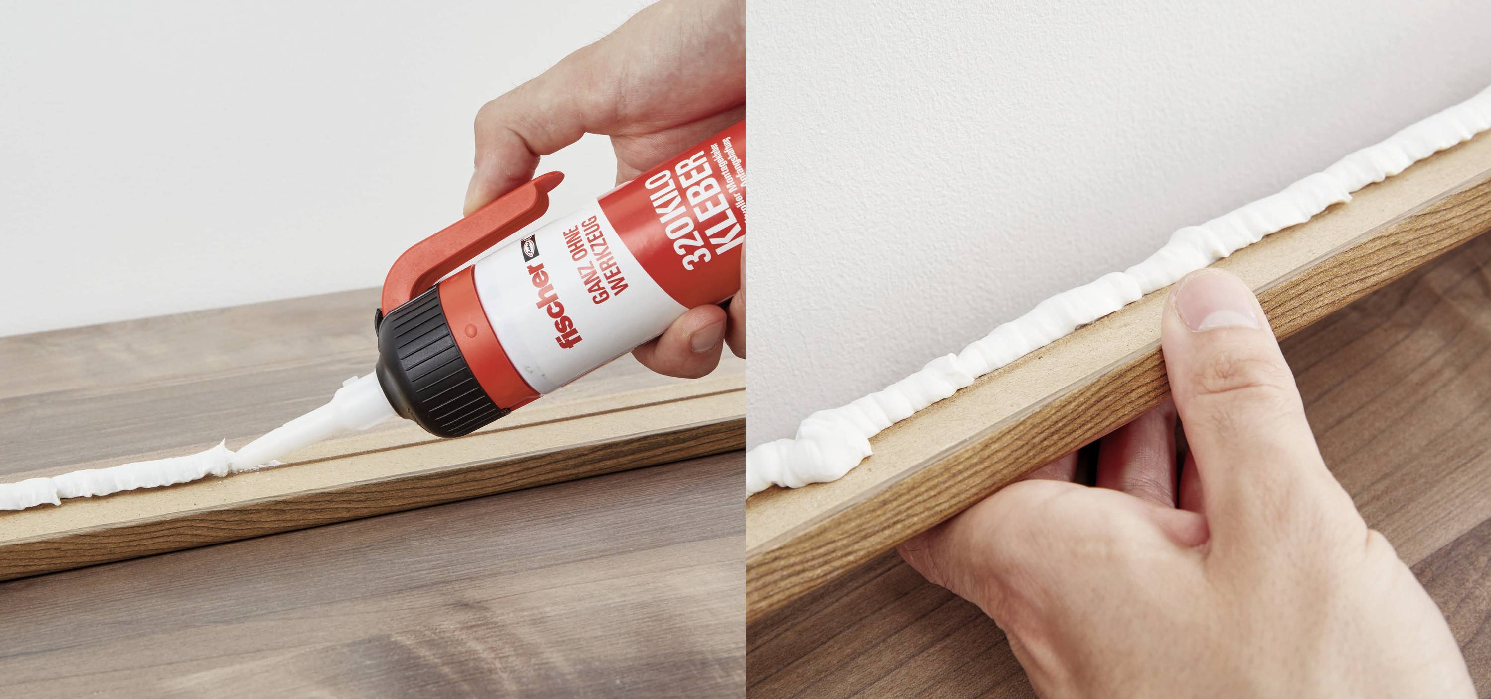 Jemand trägt mit einer Klebepistole Kleber auf ein Holzbrett auf und befestigt es an einer weißen Wand.