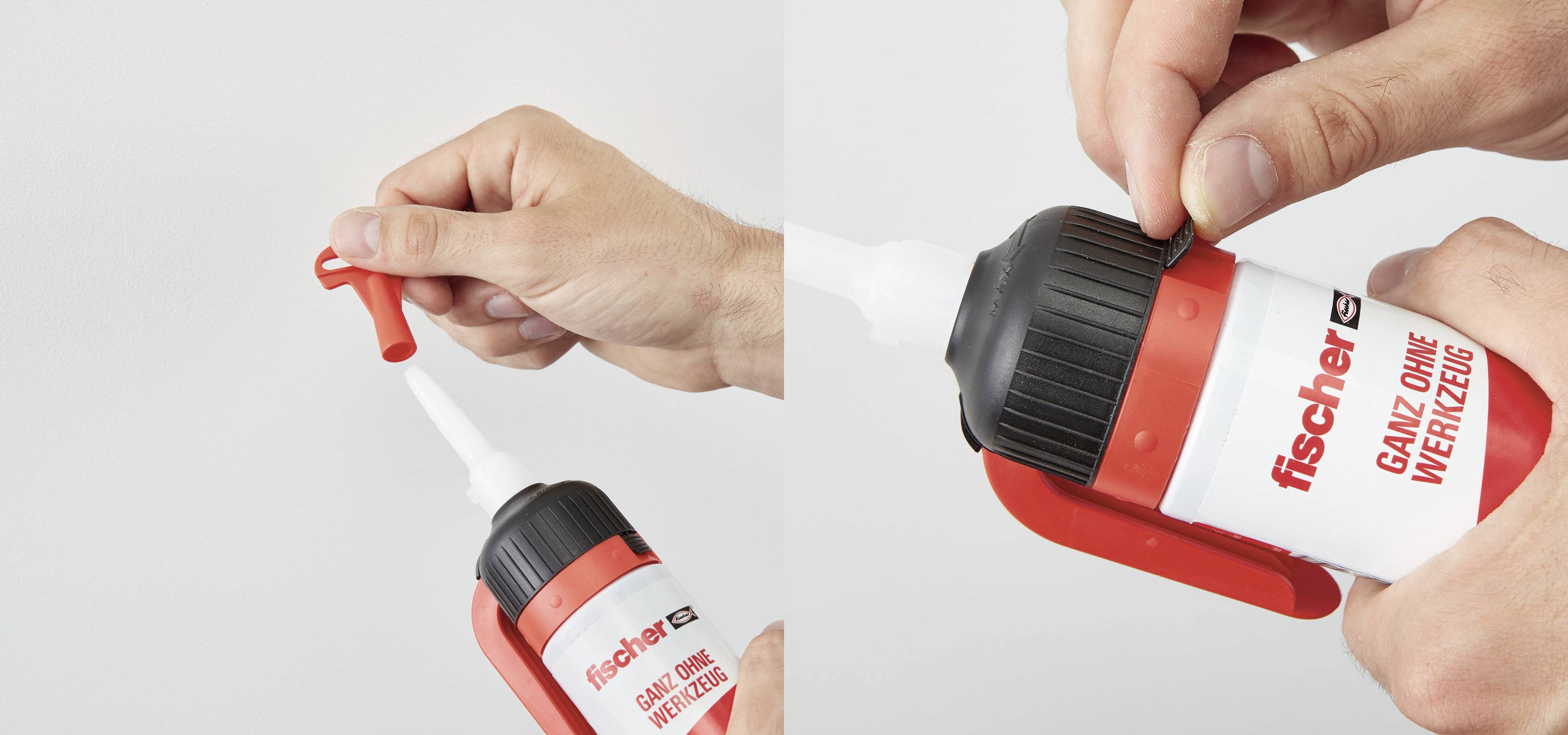Zwei Hände zeigen das Öffnen und die Anwendung eines roten Klebers mit der Aufschrift 'fischer GANZ OHNE WERKZEUG' auf der Verpackung.