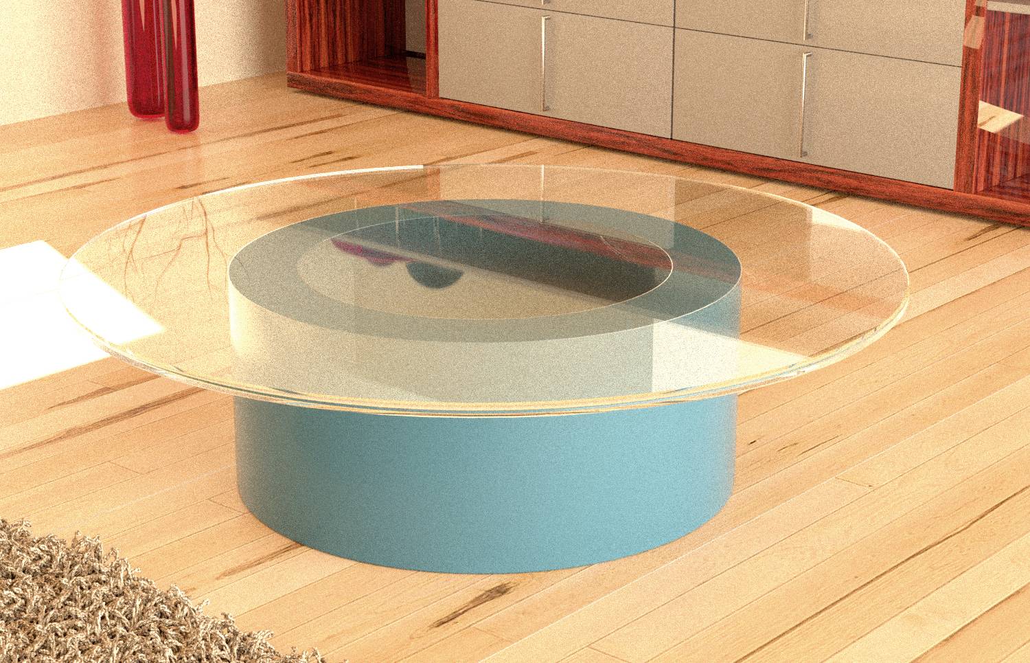 Runder Couchtisch aus Glas mit blauem Sockel steht auf einem Holzboden, umgeben von modernen Möbeln.