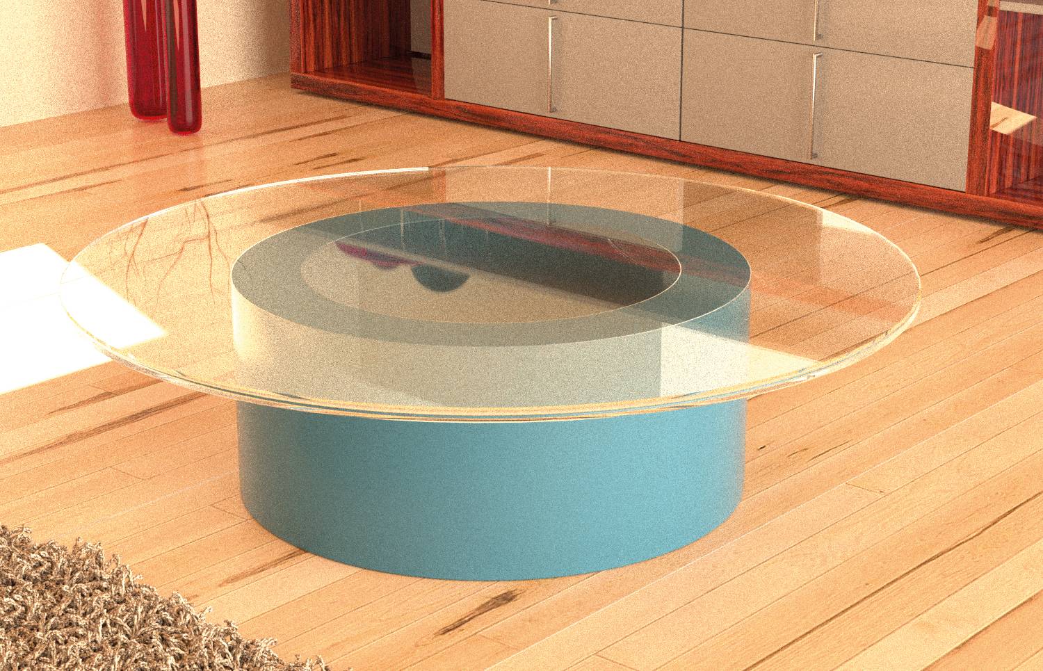 Moderner Wohnzimmer-Couchtisch mit einer runden Glasplatte und blauem zylindrischem Sockel auf einem Holzboden.