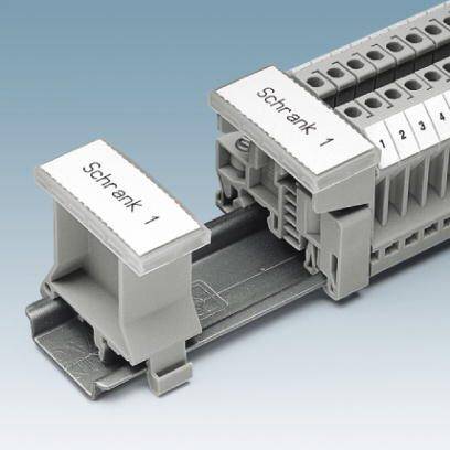 'Schrank 1' ist auf einem grauen Klemmenblock abgebildet, der für elektrische Verbindungen verwendet wird, mit nummerierten Slots.