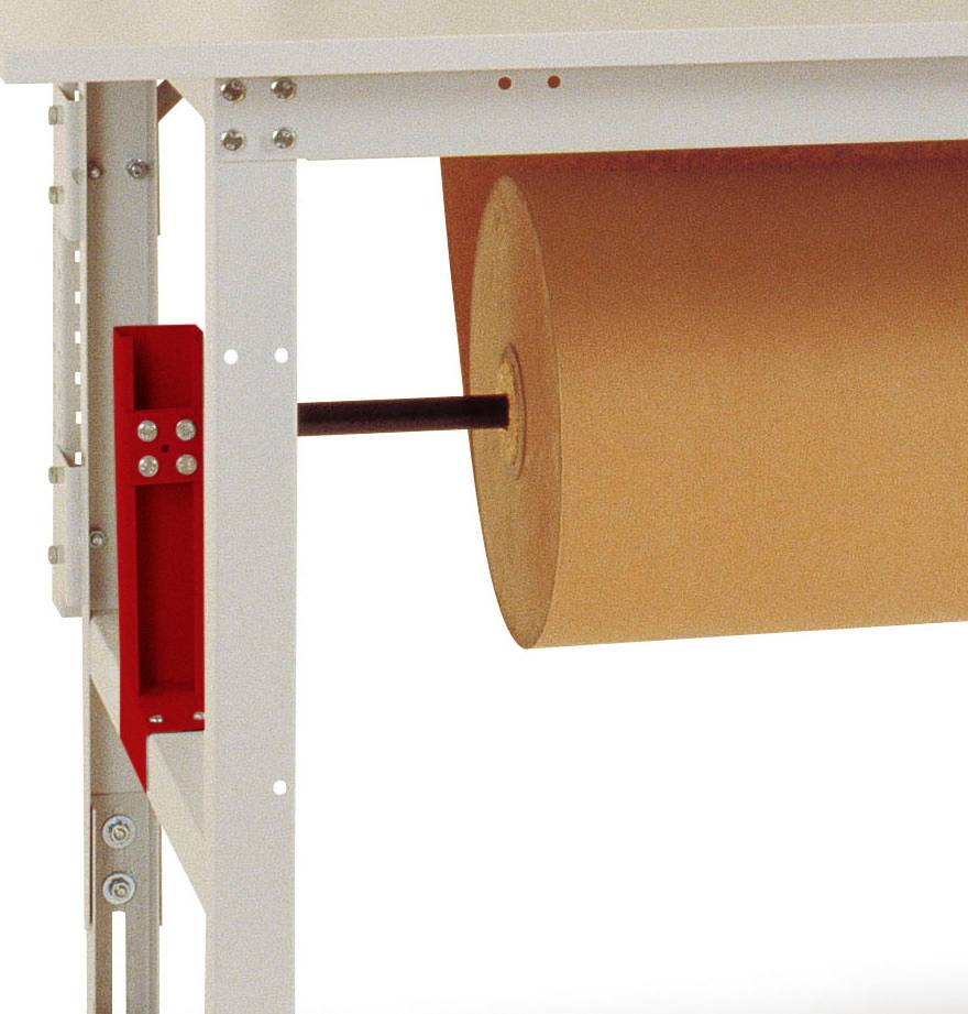 Eine große Papierrolle ist unter einem Tisch montiert, bereit zum Abrollen. Sie befindet sich an einem Metallgestell.