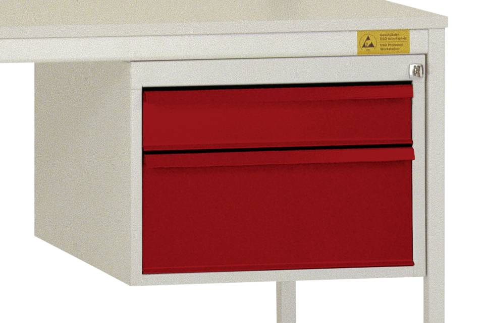 Weißer Schreibtisch mit roter Schublade auf der rechten Seite und einem Sicherheitswarnschild oben rechts.