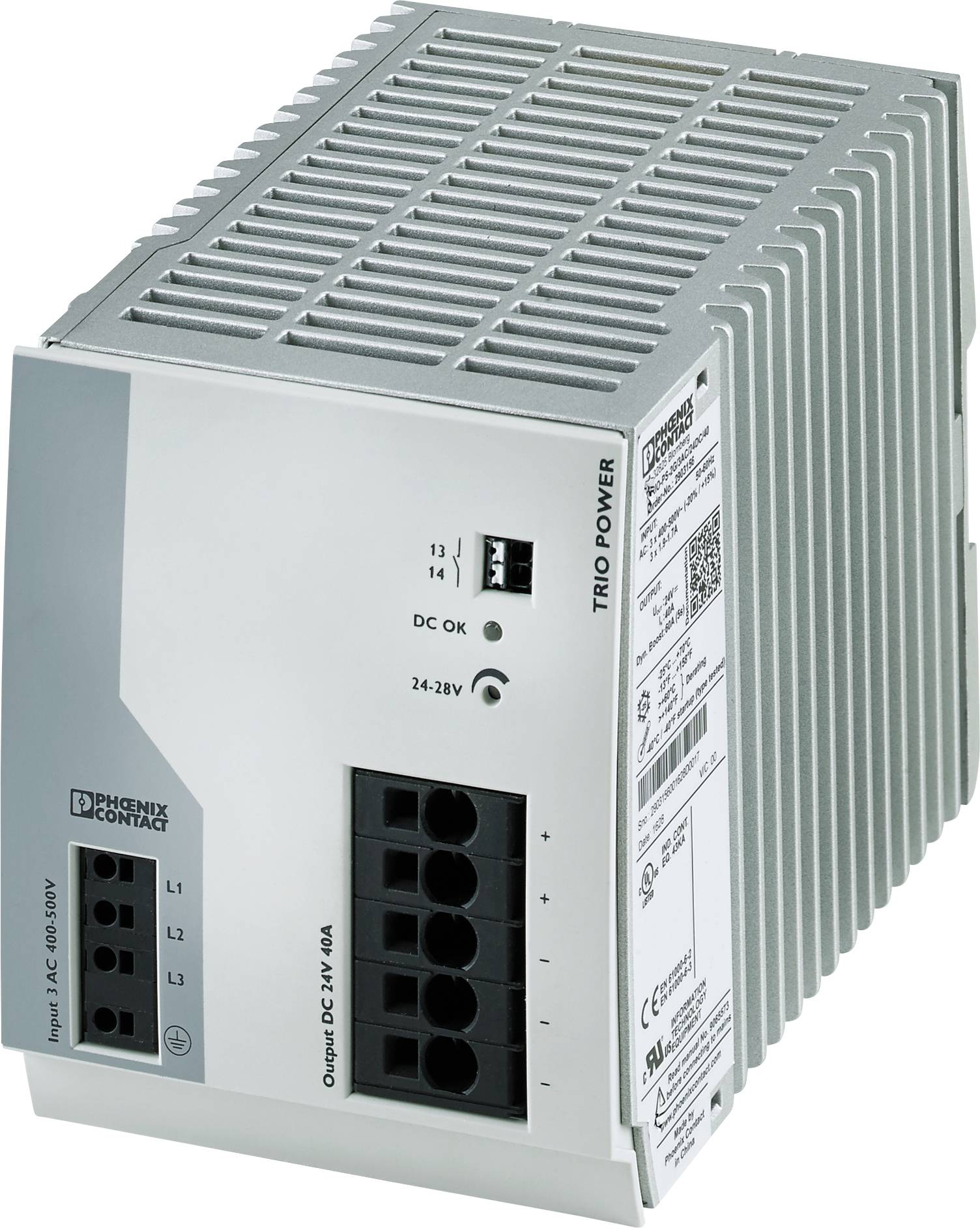 Ein graues Schaltnetzteil von Phoenix Contact, Modell TRIO POWER, mit Anschlüssen und technischen Angaben an der Seite.