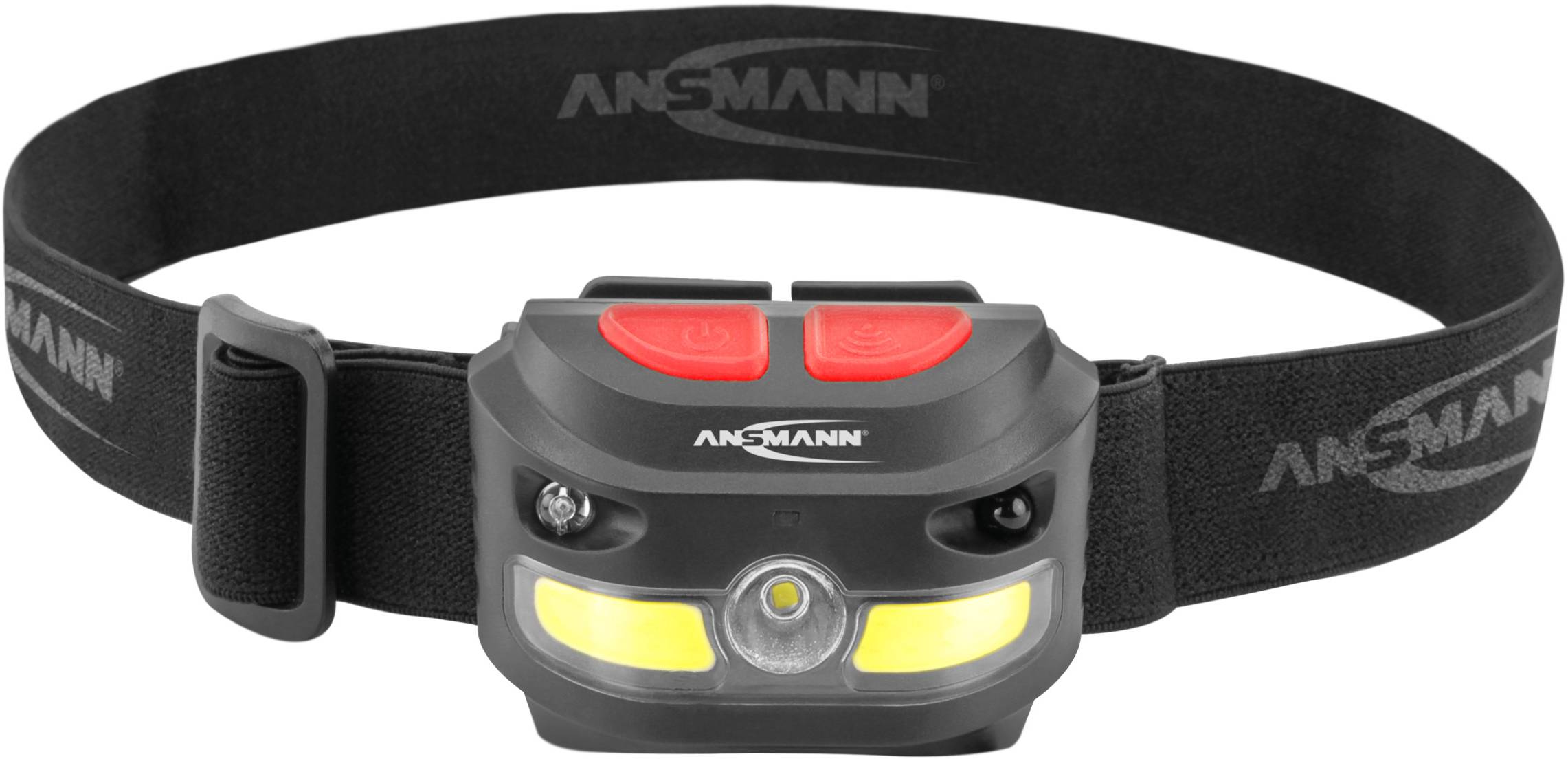 Stirnlampe mit schwarzem Kopfband, zwei roten Knöpfen und gelber Leuchteinheit. Marke 'Ansmann' auf der Lampe sichtbar.