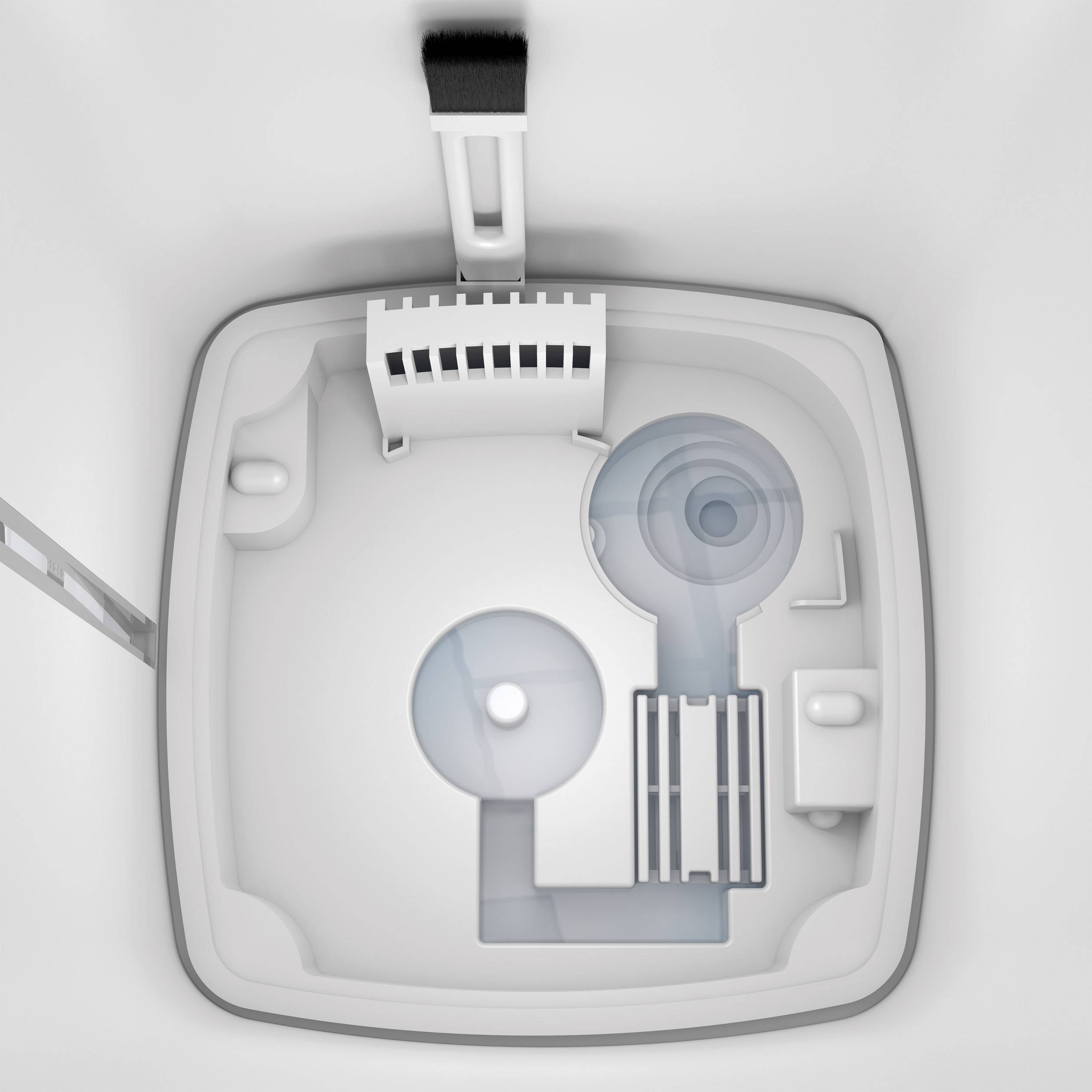 Weiße, quadratische Toilettenkabine von oben. Mehrere Gehäuseelemente und Behälter sind darin eingebaut.